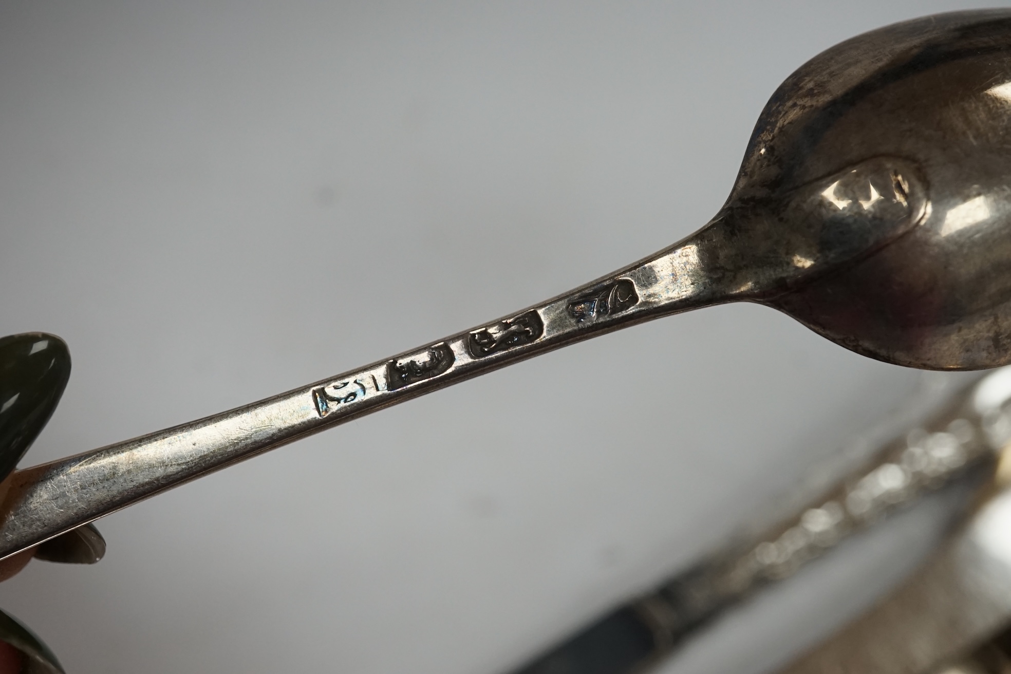 Sixteen assorted items of silver flatware, including mainly 19th century spoons, 9.2oz, together with a set of six later silver handled tea knives. Condition - Poor to fair